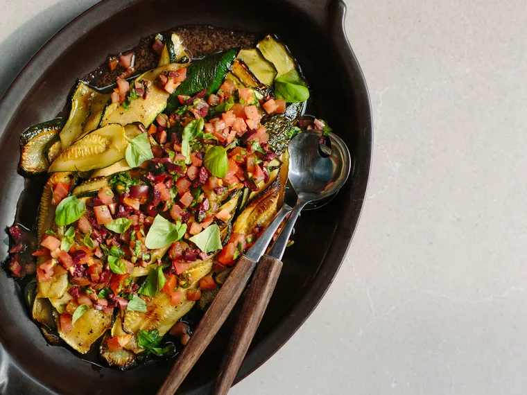 Grilled courgette with tomato, basil and black olive salsa
