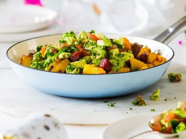 Kumara, potato and chorizo hash with tomato and avocado herb salad
