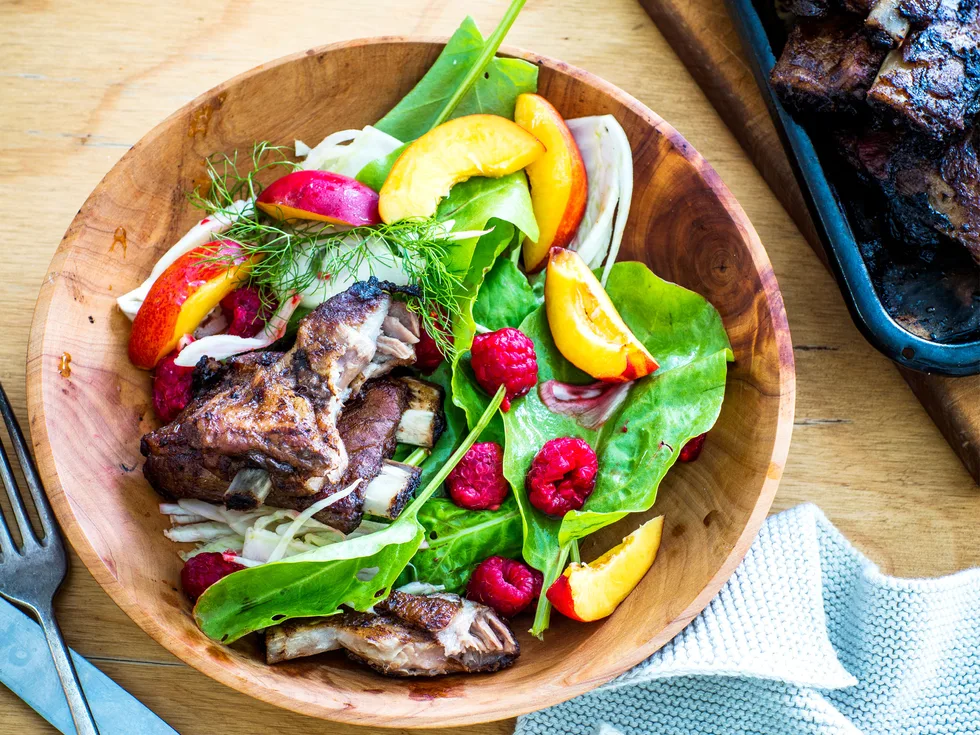 Maple pork baby back ribs with raspberry and fennel salad