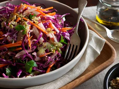 Red cabbage winter slaw with orange dressing and salted seeds