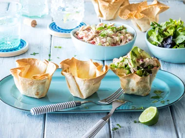 Crispy tortilla bowls with chilli chicken salad and avocado