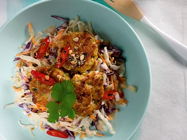 Spicy fish cakes on Japanese style slaw