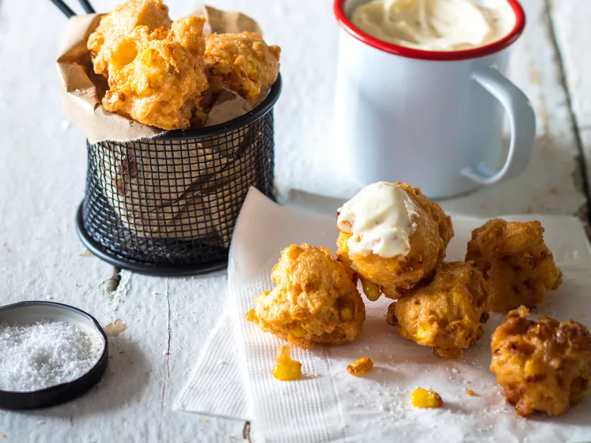 Cheese, corn and cayenne beignets with aioli