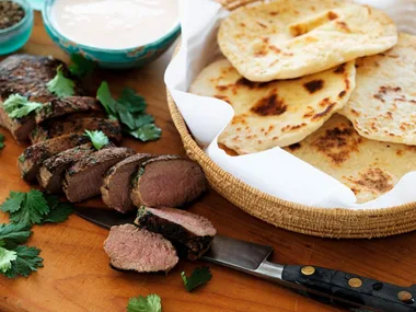 Moroccan-spiced lamb with coriander, flat bread and chilli yoghurt