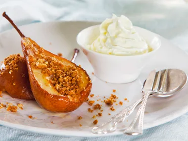 Honey baked pears with whipped cream and ginger crumb