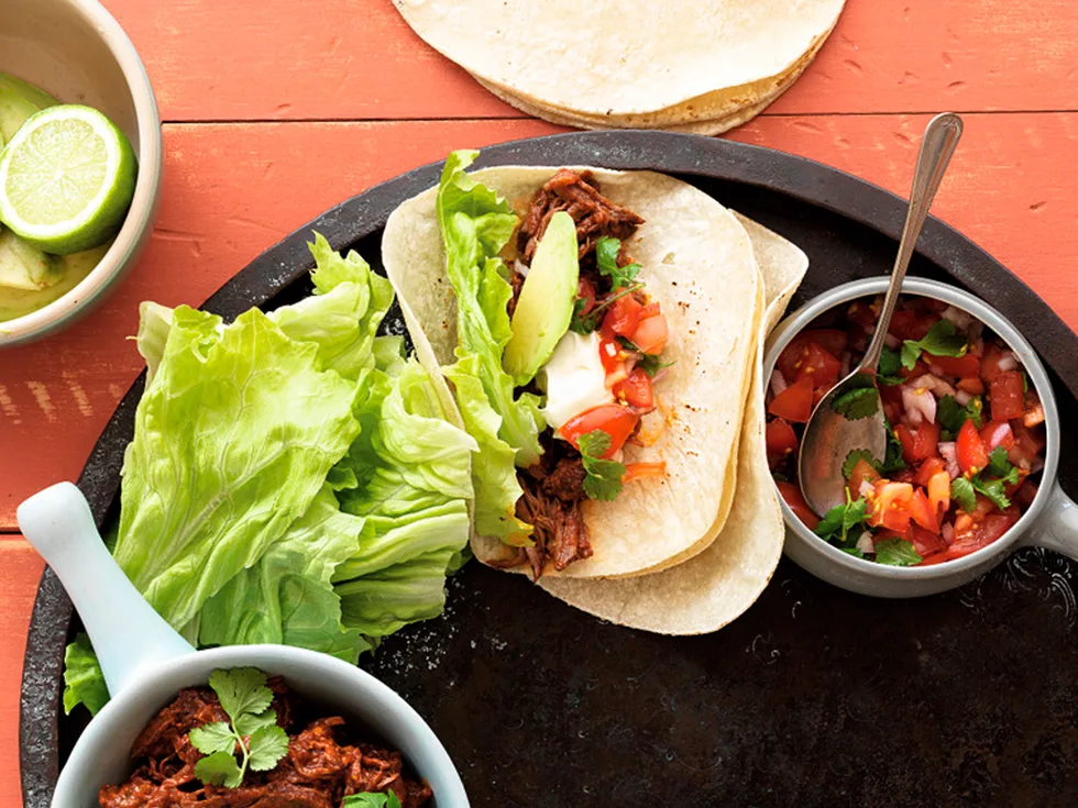 Slow-cooked Mexican beef with soft tortillas and fresh tomato salsa
