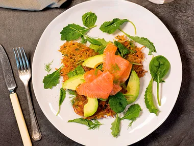 Smoked salmon, baby greens and avocado on kumara hash cakes