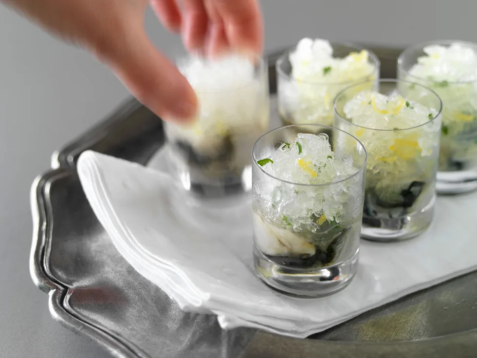Oyster shots with vodka and lemon ice