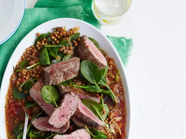 Roast lamb with braised lentils