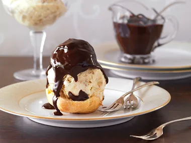 Profiteroles with gingernut ice cream and chocolate fudge sauce