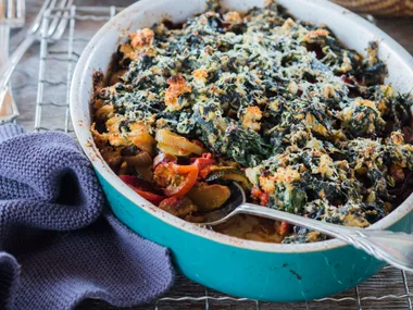 Summer vegetable bake with cheesy spinach topping