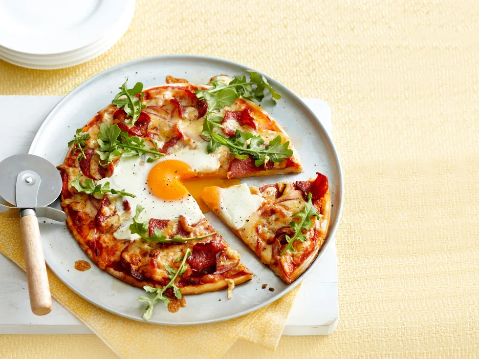 Egg and salami pizzas