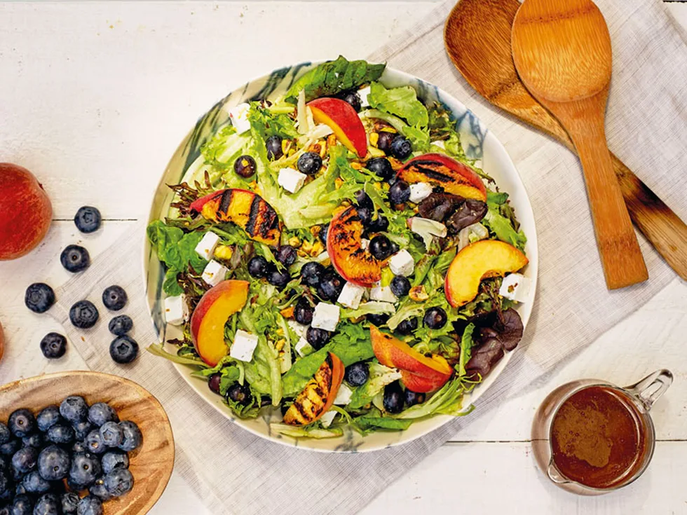 Fancy lettuce, blueberry, goats’ cheese and barbecued peach salad