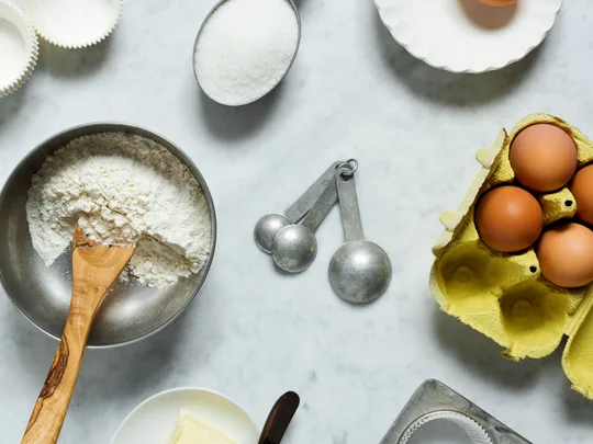 Why do some of your recipes use cup measures and others grams?