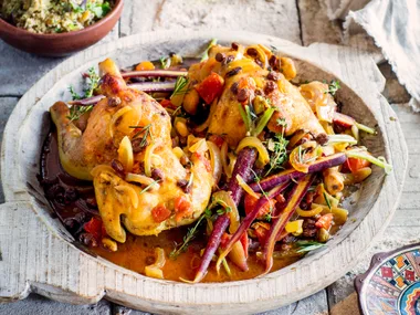 Baked baby chicken in saffron with fruit and nut couscous
