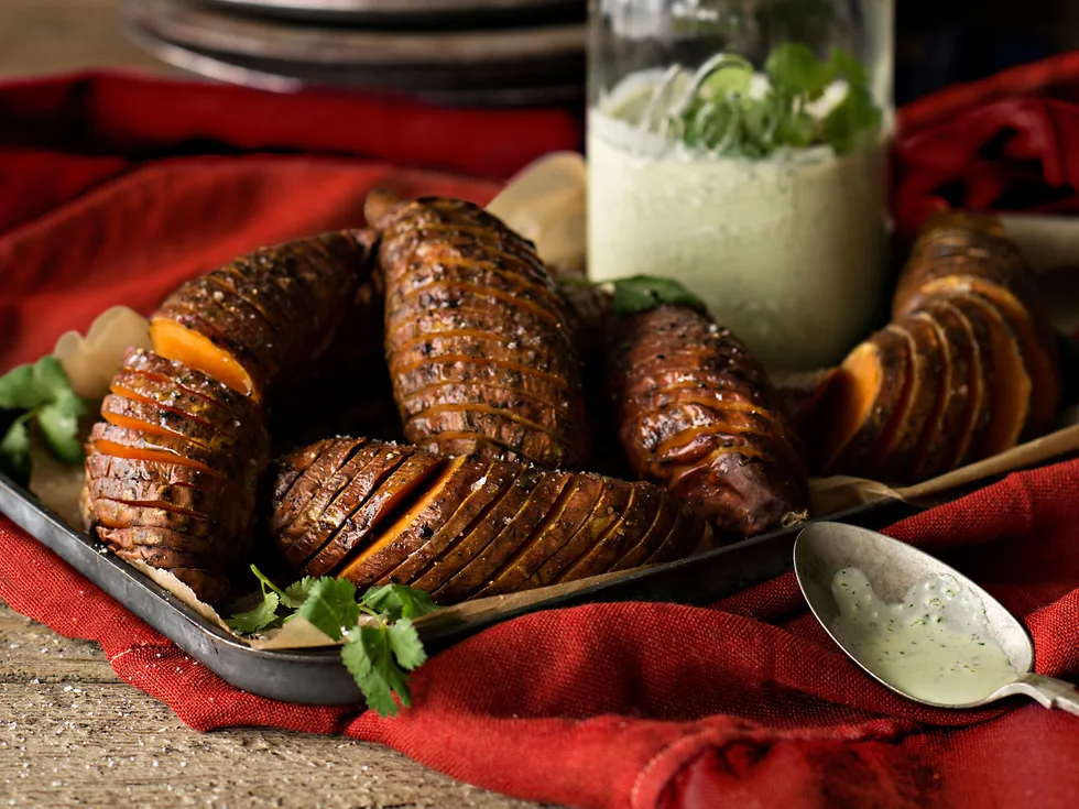 Hasselback kumara with green yoghurt sauce