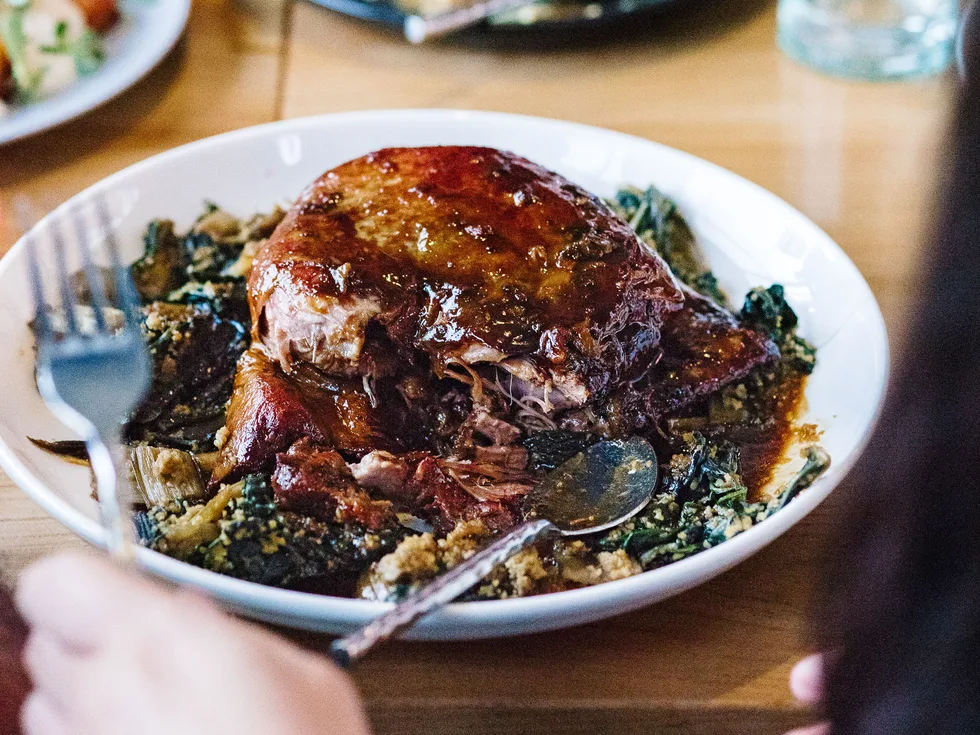 Braised lamb shoulder with uli spinach