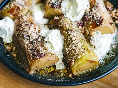 Leeks braised in caraway with thyme butter and hazelnuts