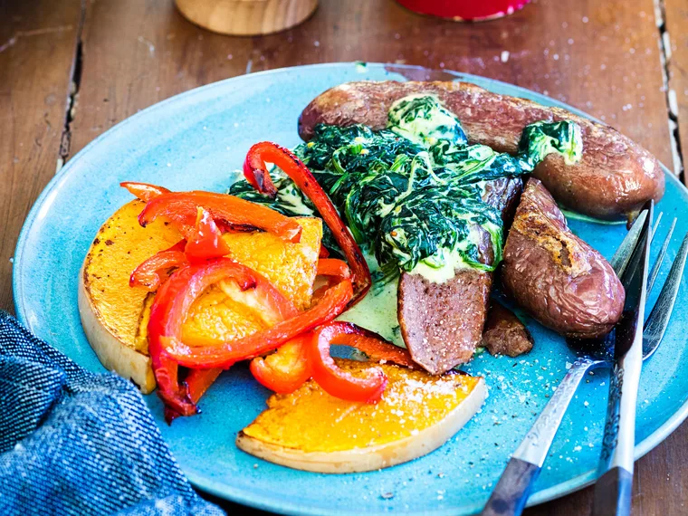 Baked sausages with creamed spinach