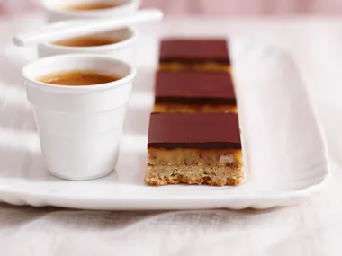 Dark chocolate nut slice with salted caramel filling