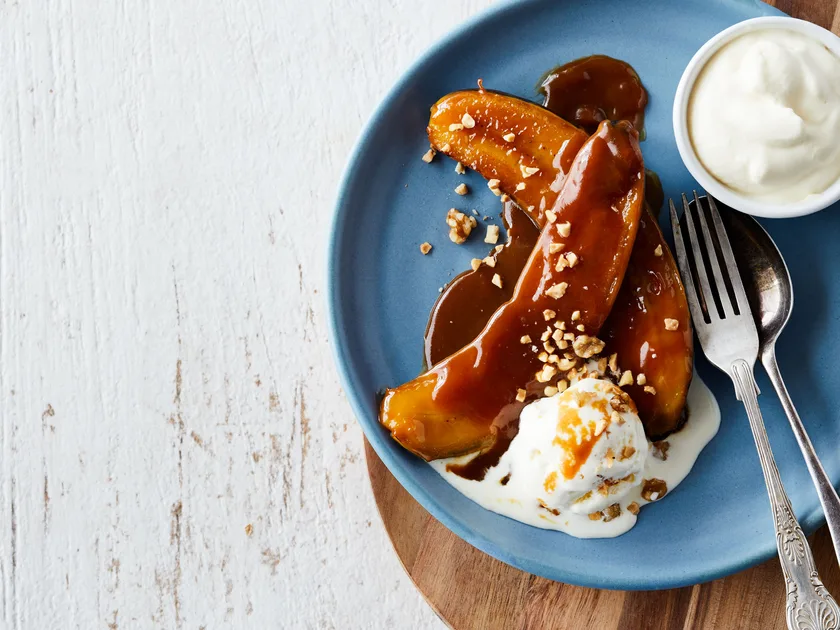 Banana split sundae with warm toffee rum sauce