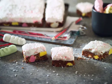 Chocolate lolly cake slice with gooey marshmallow frosting