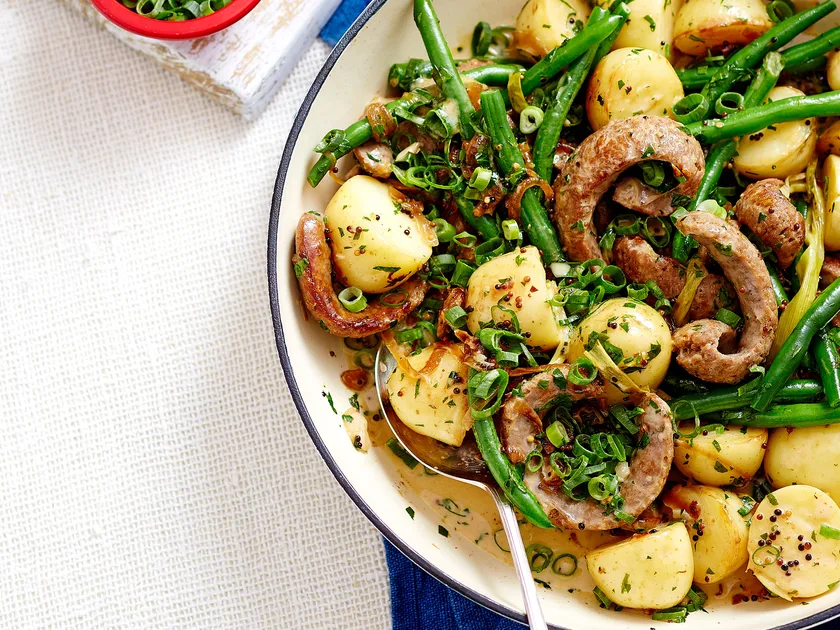 One-pot beer-braised sausages with warm potato salad