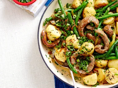 Beer-braised sausages with warm potato salad