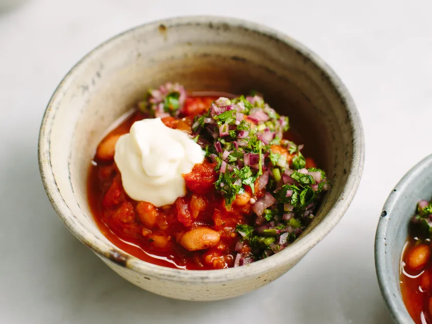 Spicy bean stew with red onion salsa