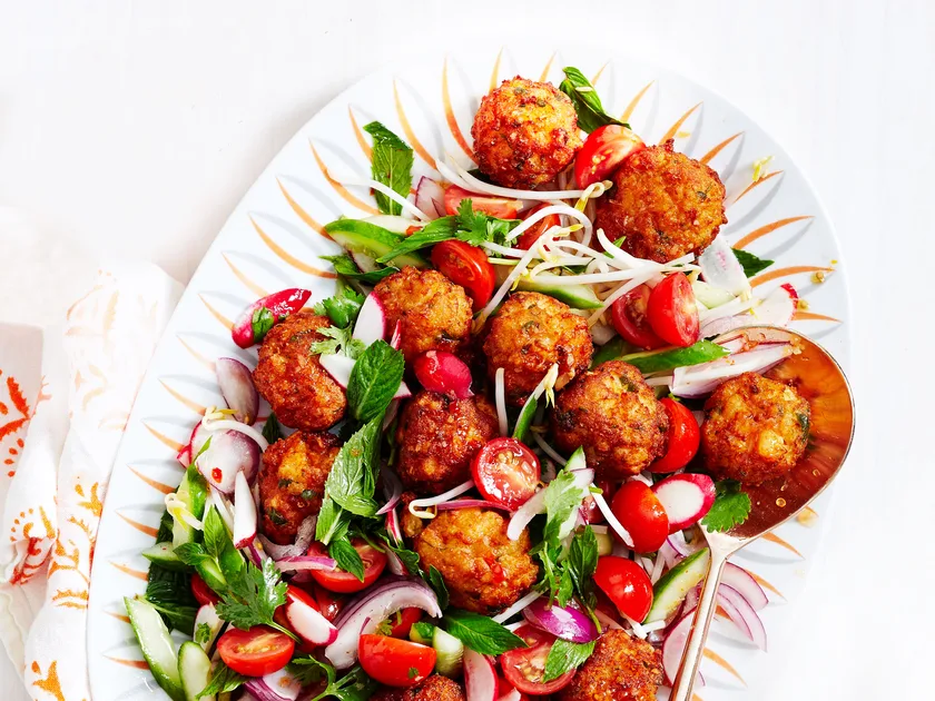 Warm prawn cake salad with sweet chilli dressing