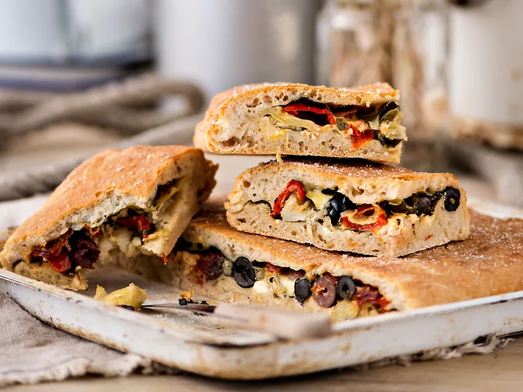 Stuffed focaccia bread with spinach, olives and feta