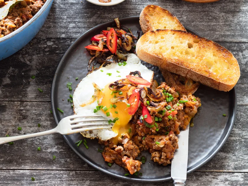 Fancy mince on toast with chilli, onions and egg
