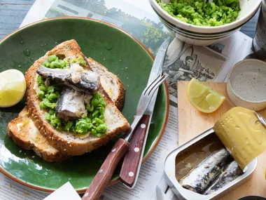 Crushed lemony peas and sardines on toast