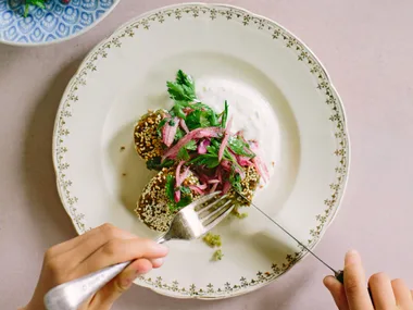Broad bean falafel with preserved lemon yoghurt and red onion sumac salad