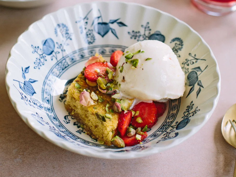 Honey almond cake with pistachios, strawberries and hibiscus rose syrup