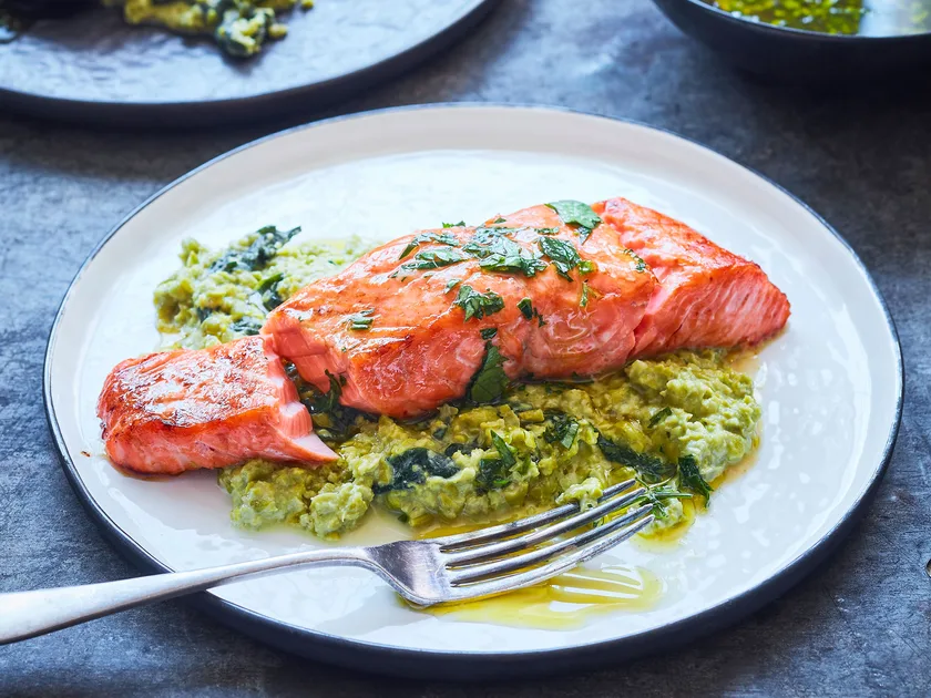 Grilled salmon with pea smash and herby lemon dressing