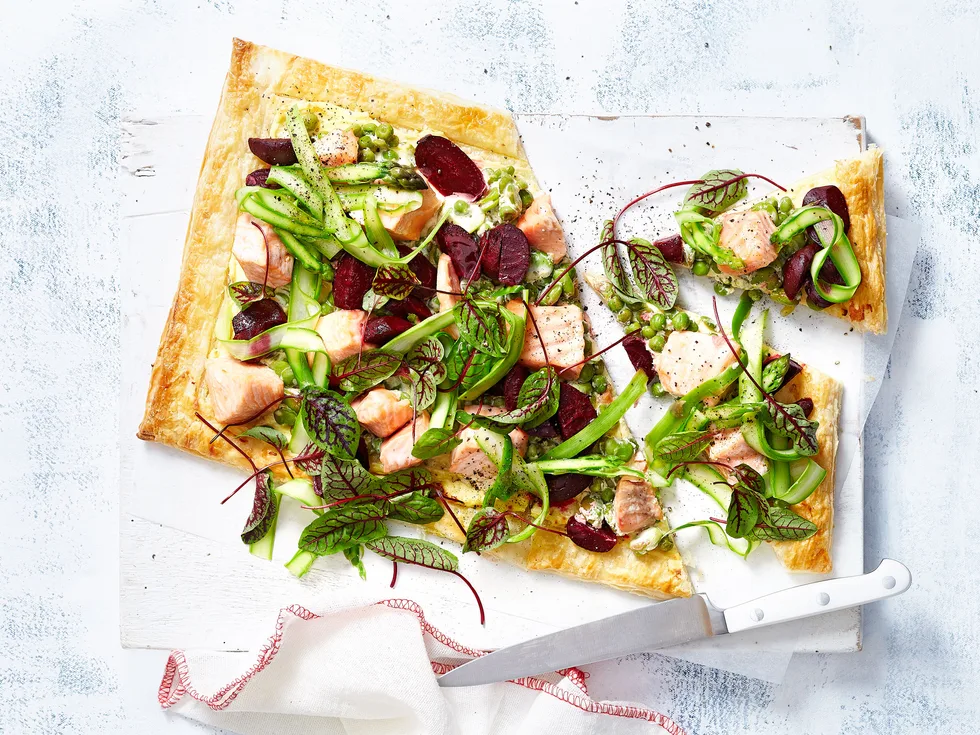 Salmon and beetroot tart with broad bean and pea topping