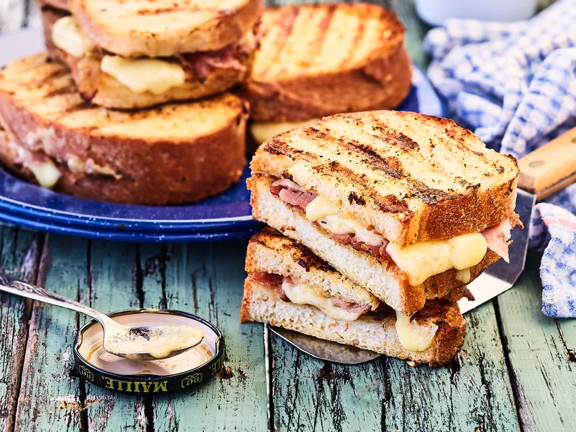 Grilled French toasted sandwiches with mustard and ham