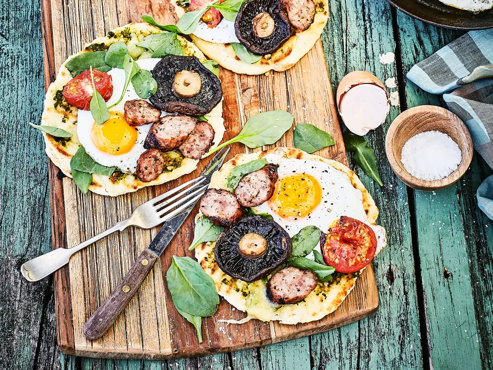 Bushman's bread breakfast pizza with eggs and sausages