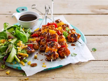 Sticky maple bacon and chicken skewers with cherry pecan salad