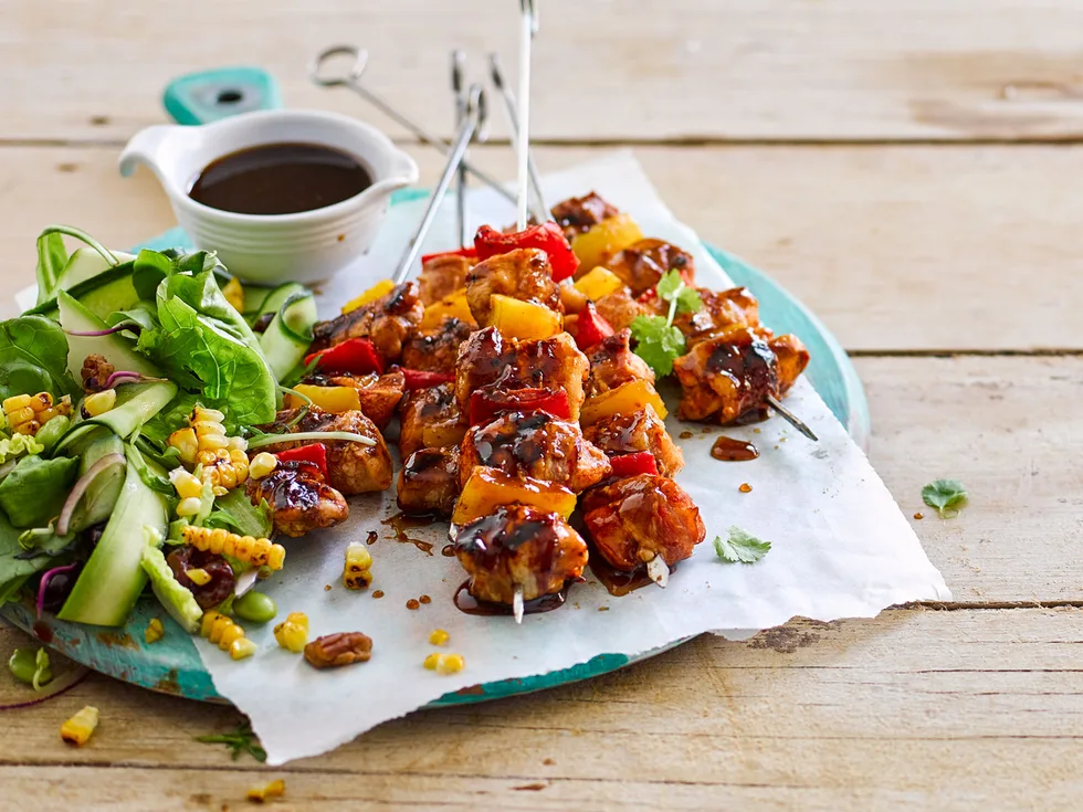 Sticky maple bacon and chicken skewers with cherry pecan salad