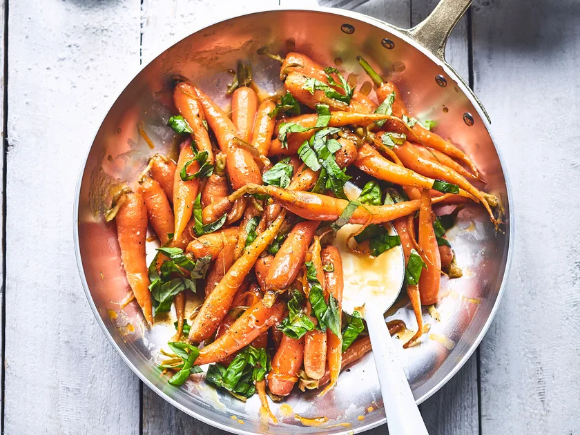 Cranberry, orange and brown sugar glazed carrots with basil