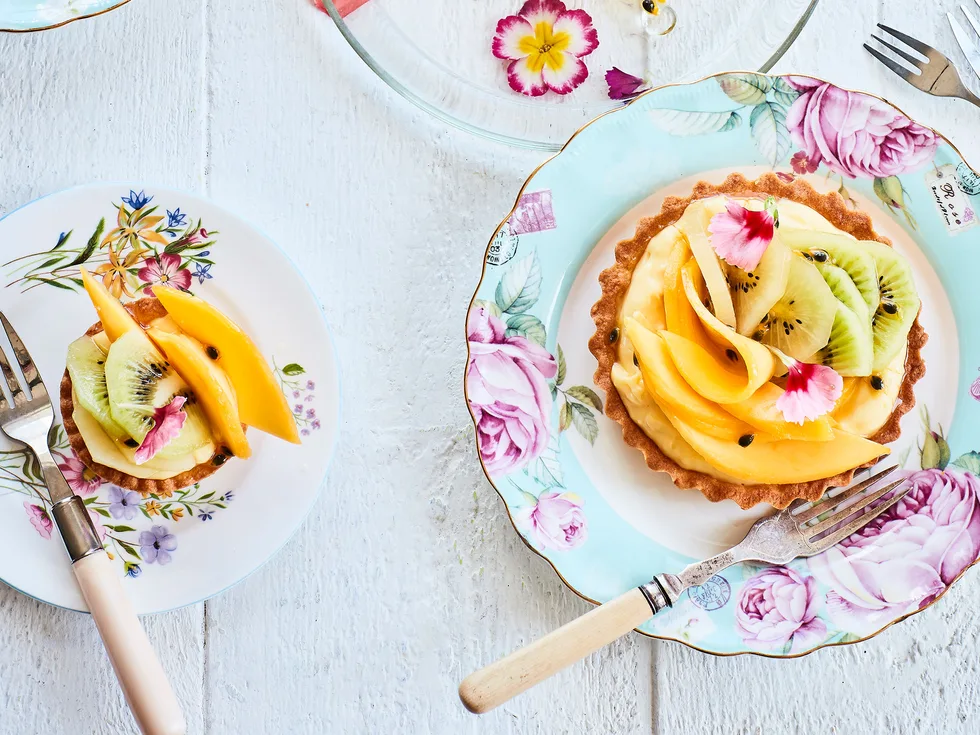 Summer custard fruit tarts with passionfruit and lime syrup