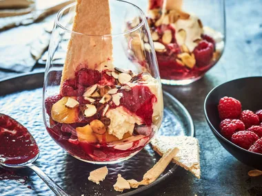 Nectarine knickerbocker glory with meringue shards and raspberry sauce