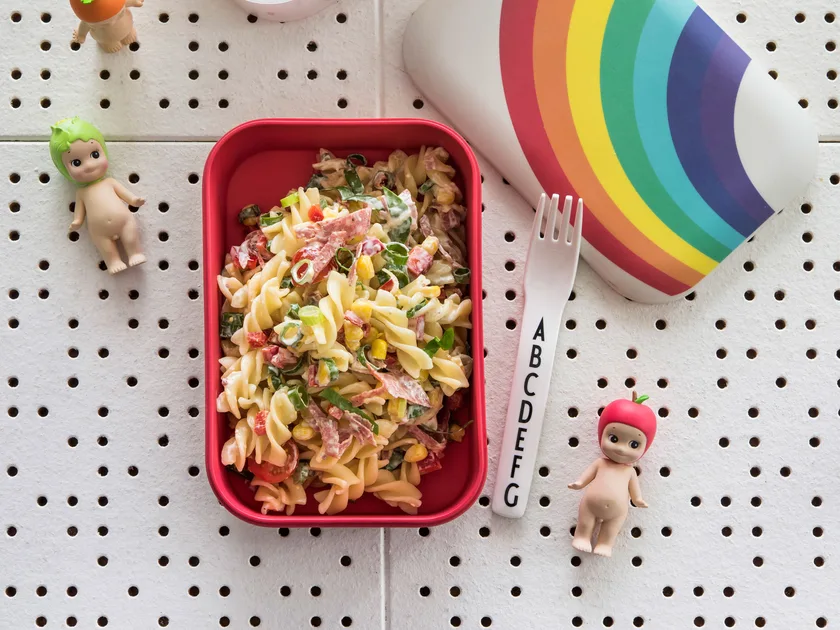 Lunchbox pasta salad with salami, corn and mayo dressing