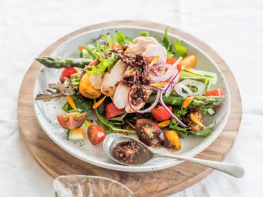 Smoked chicken summer salad with black olive dressing