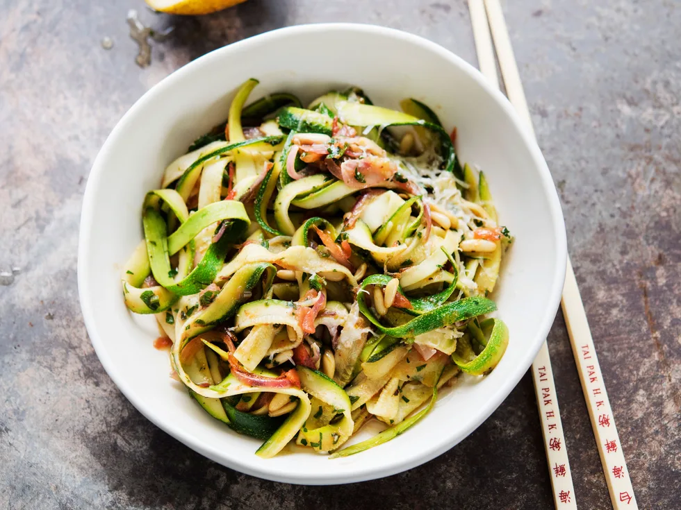 Courgette noodles with a warm pine nut and herb dressing
