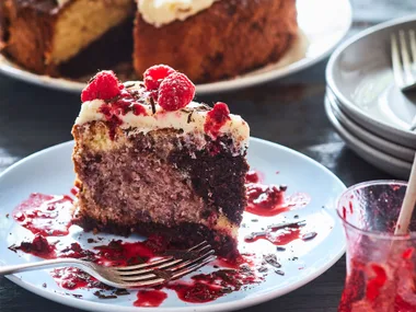 Fresh berry Neapolitan cake with vanilla cream cheese icing