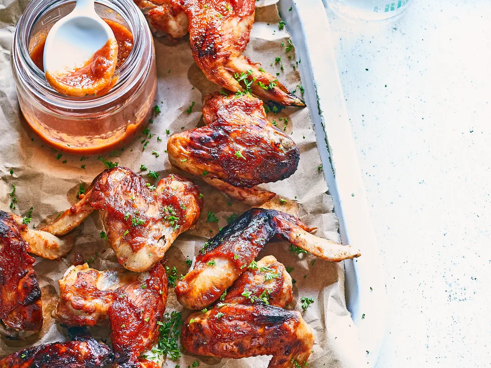 Baked chicken wings with peachy barbecue sauce