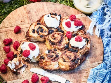 Quick sticky buns with cream cheese icing and berries